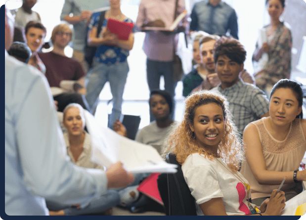 Students attentively listening during a lecture.