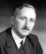 Black-and-white portrait of bespectacled man in suit