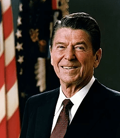 Smiling man in suit with American flag