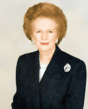 Formal portrait of an older woman with brooch